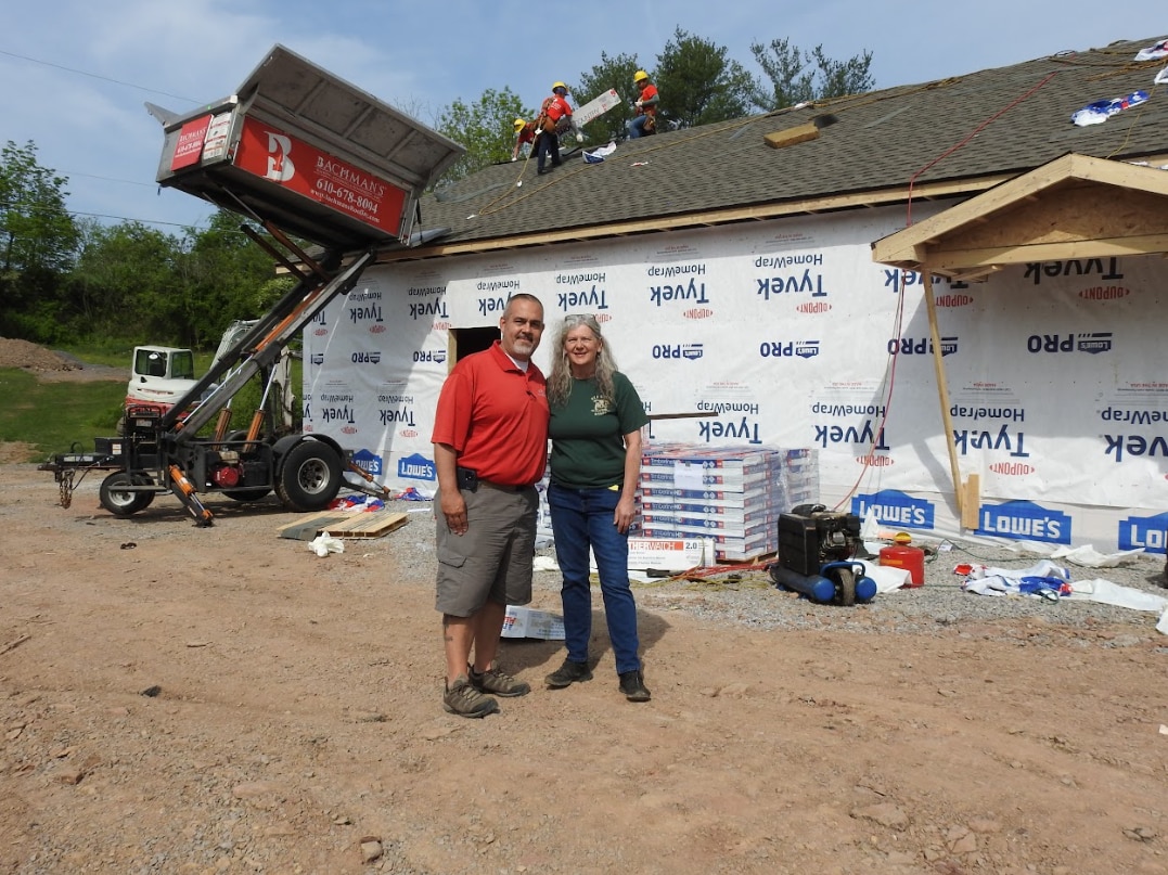 the new red creek wildlife center building while under construction Team members from the wildlife center recovery efforts pose in front of the new building