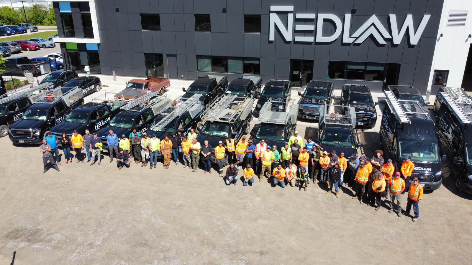 The Nedlaw Roofing Team in front of their new corporate building