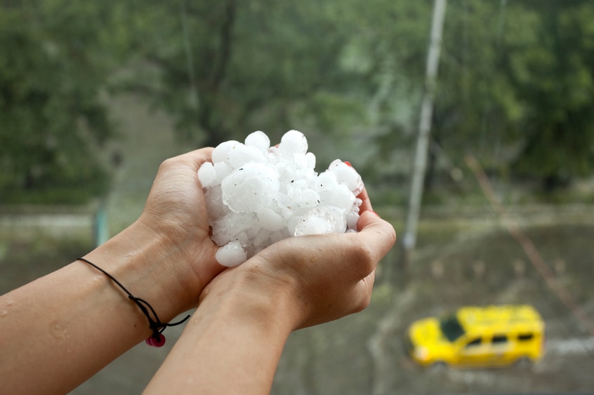 Two hands outstretched holding hail