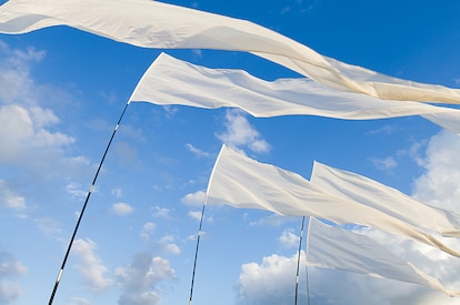 white flags flowing in the wind