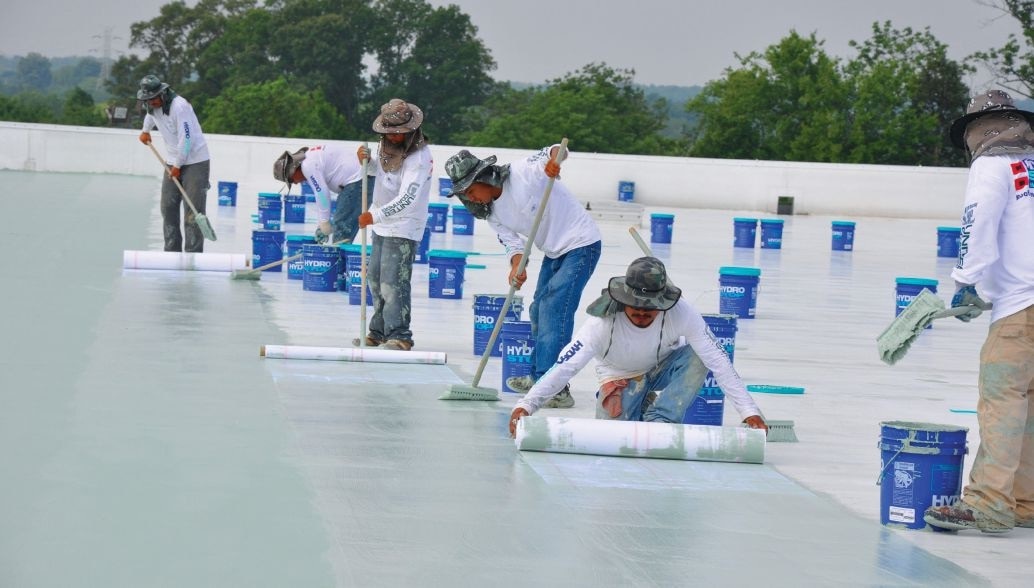 Installation of a liquid membrane system using a water-based acrylic topcoat