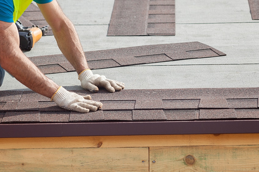 GAF contractor installing 3-tab shingles on a new roof.