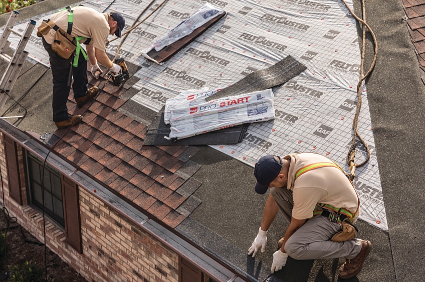 Men installing roofing
