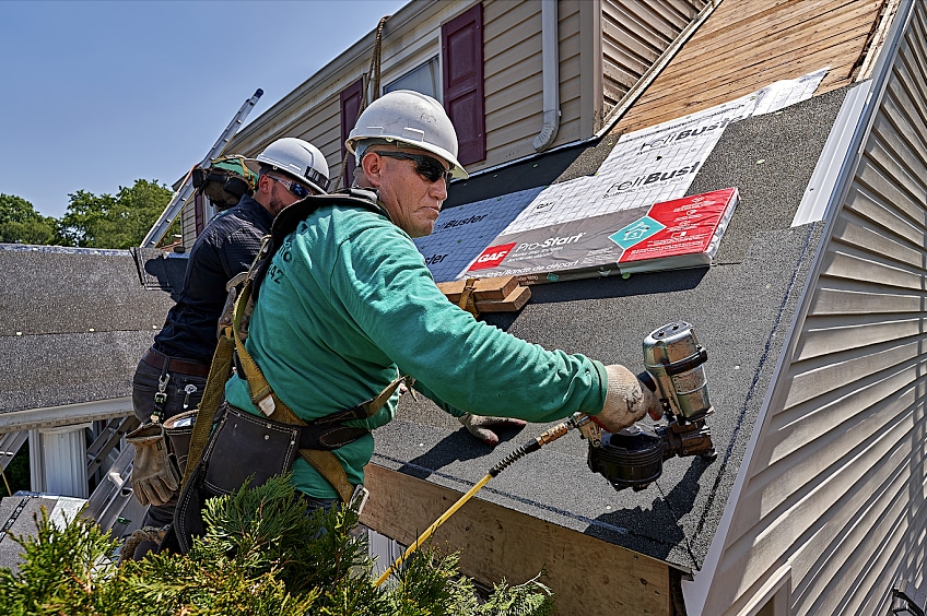 Men installing roofing