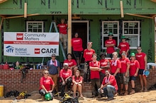 Carter Work Project team in front of house