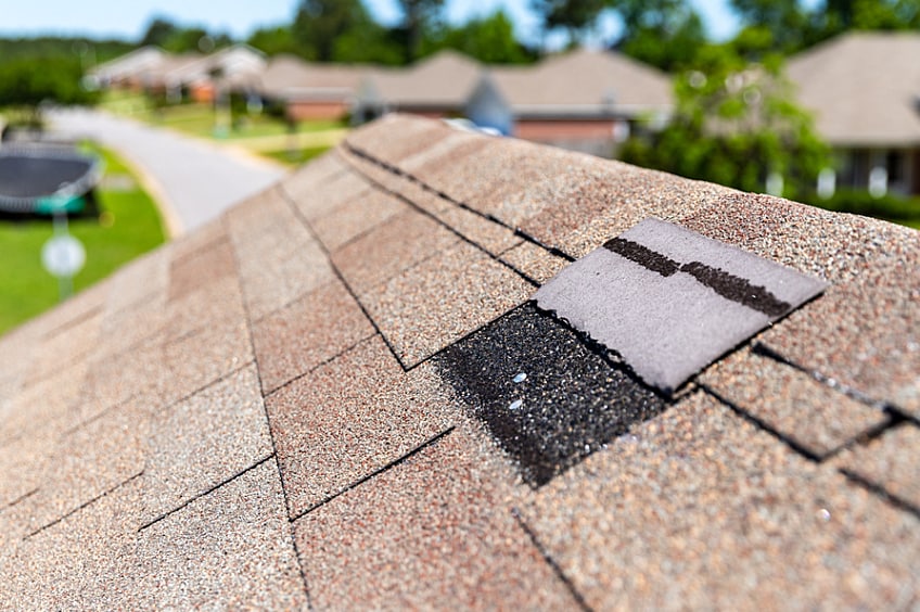 Missing shingles on a roof.