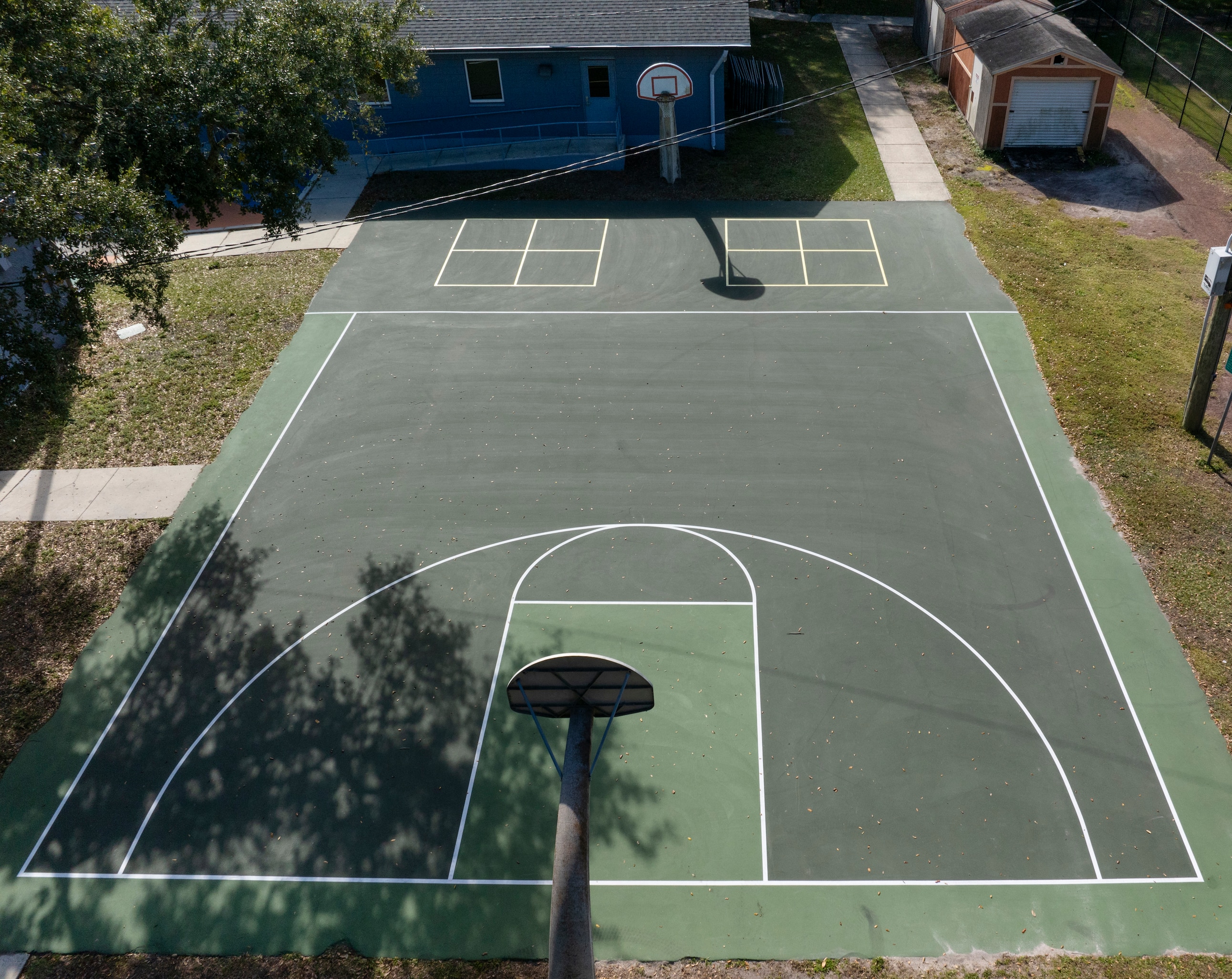 BEFORE shot of sports court in Kissimmee