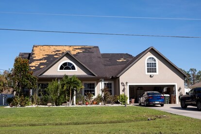 A house with a damaged roof.