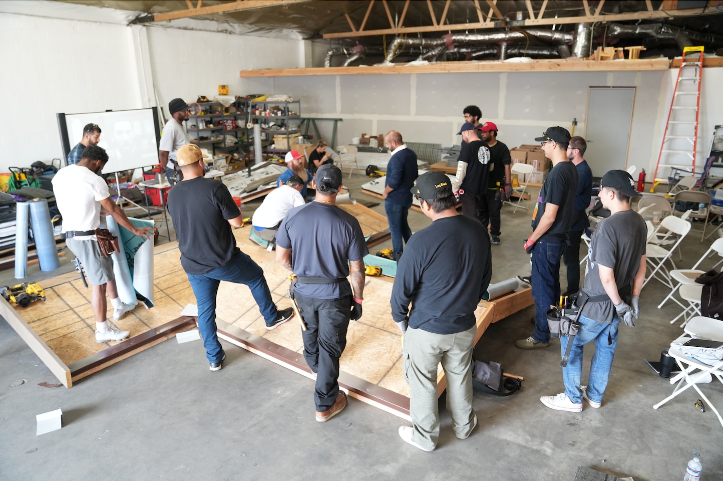 A Roofing Academy Class learning hands-on skills with an instructor
