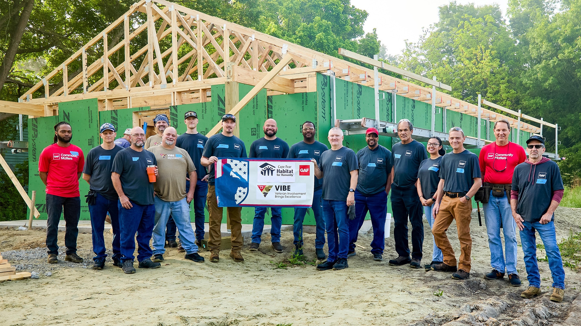 GAF Burgaw VIBE Group in front of a Habitat for Humanity build