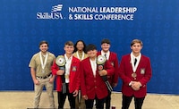 Young roofers pose at the SkillsUSA conference.
