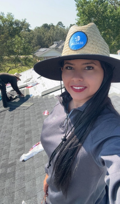 Leidys on a roof at a jobsite