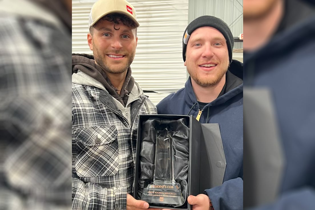Roofers from Arrow Roofing show their GAF award