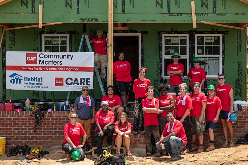 Carter Work Project team in front of house