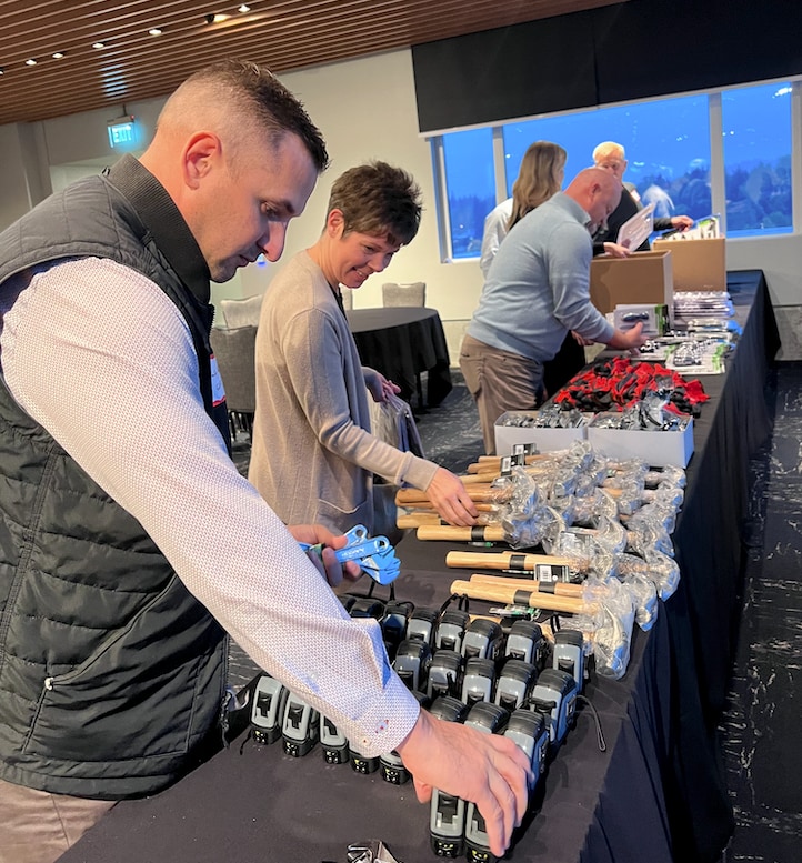 gaf community contractors gather to pack new homeowner kits A table full of new homeowner tools is set up for new homeowner kits to be created by GAF Employees and Contractor Partners