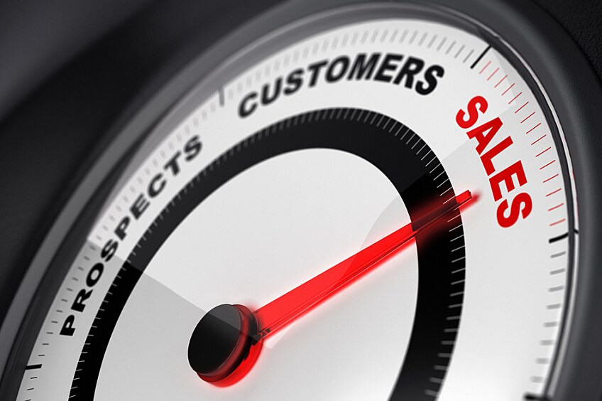 Dial with red needle pointing to sales