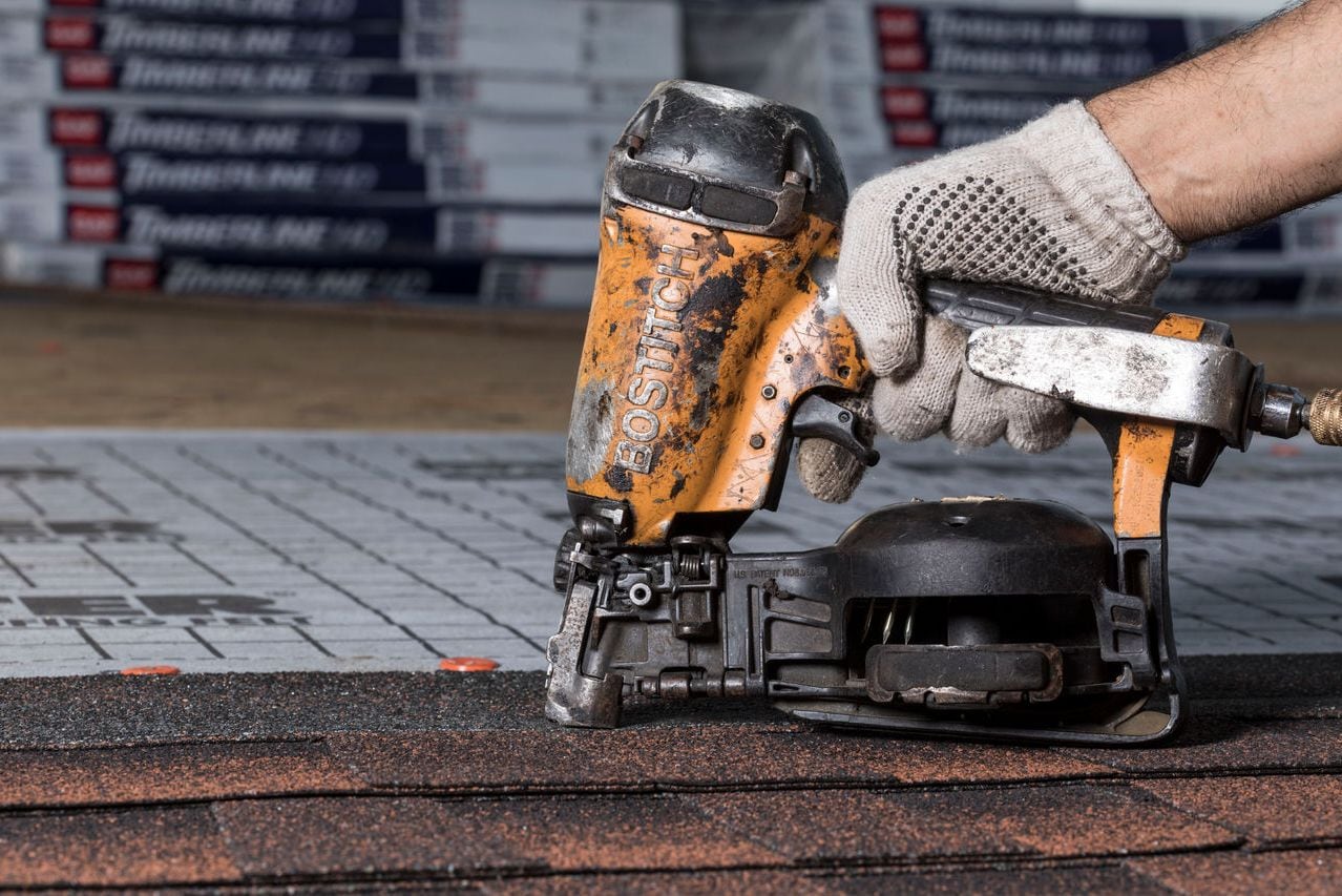 A nail gun with air compressor is essential for installing a roof