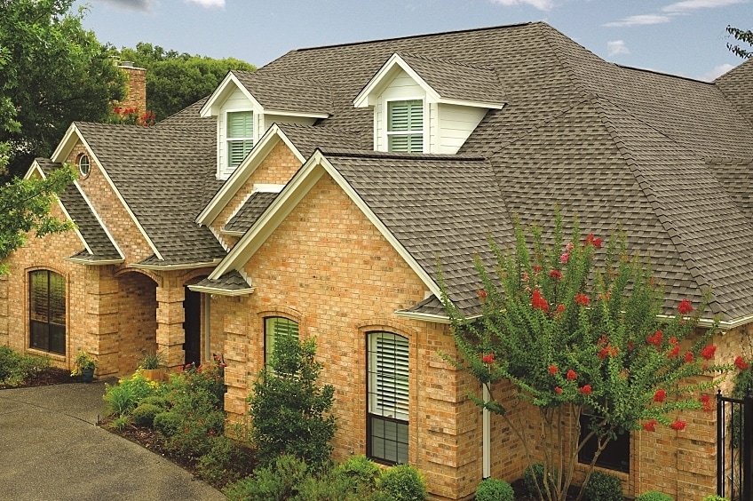 Hand holding a large hail stone.