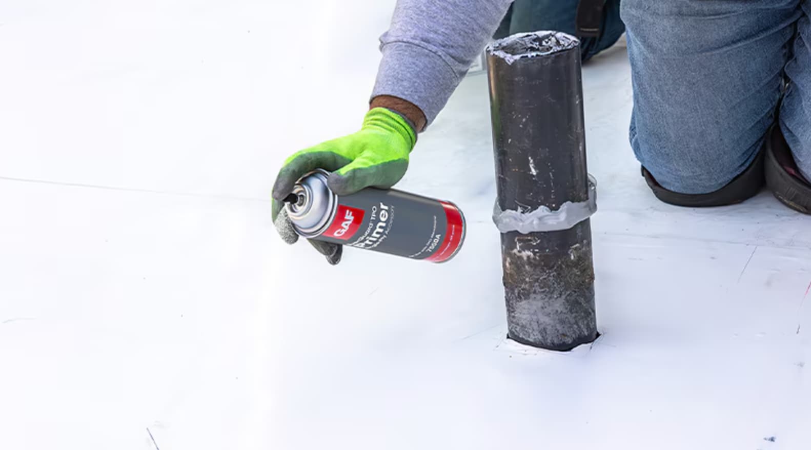 Roofer using the GAF Repair Kit on a Commercial Roof