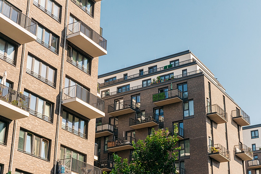Tenant catches a dripping roof leak with a bucket