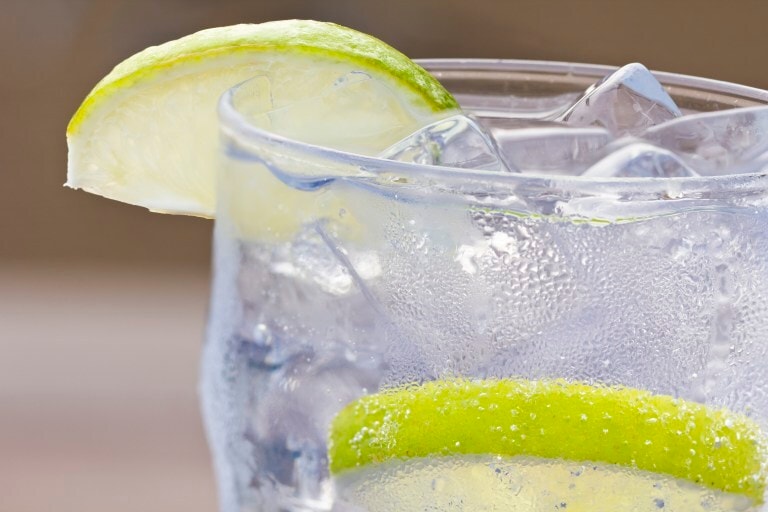 glass of water with ice lemon and condensation