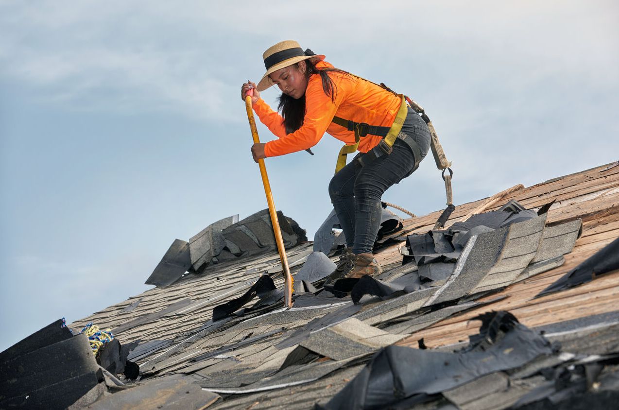 How to install roof shingles starts with tearing off the old ones. 