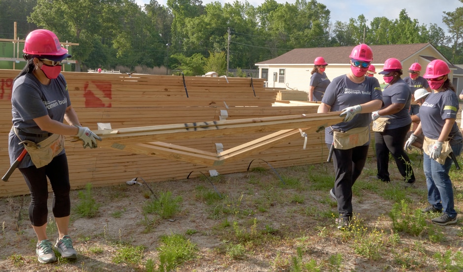 amigo volunteering moving lumber