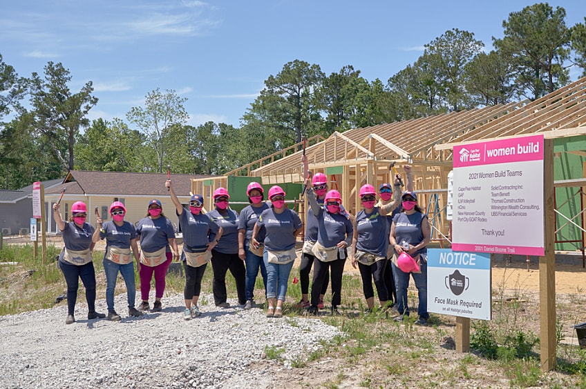 Group of volunteers cheering at the job