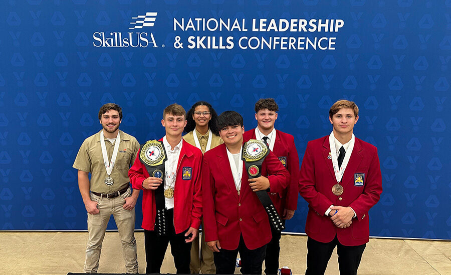 Young roofers pose at the SkillsUSA conference.