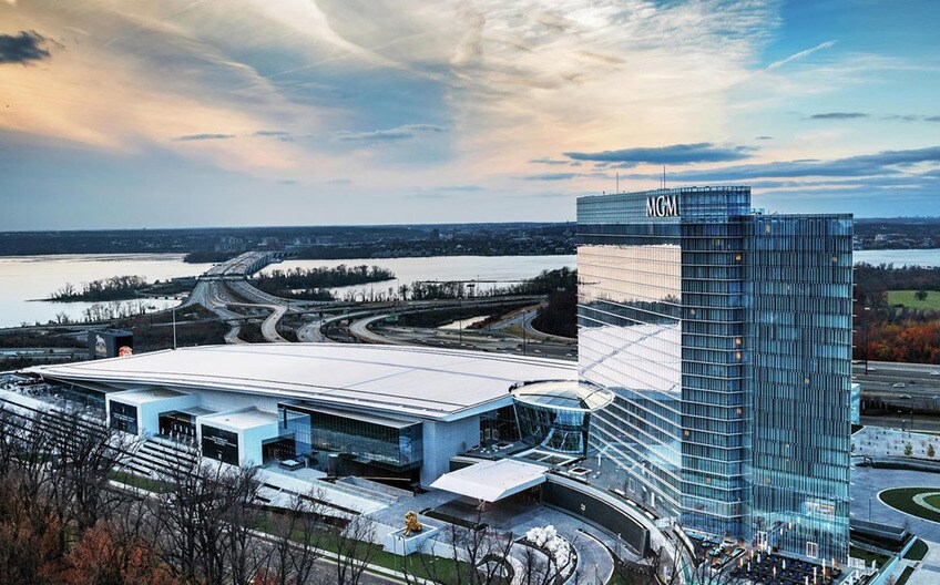A roofing contractor walks over a white vapor retarder membrane.