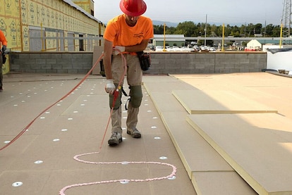 Roofer installs GAF accessories designed for utilizing the 179D solar tax credit